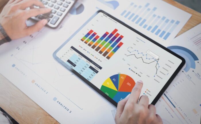 businesswoman using tablet analysis graph company finance strategy statistics success concept planning future office room