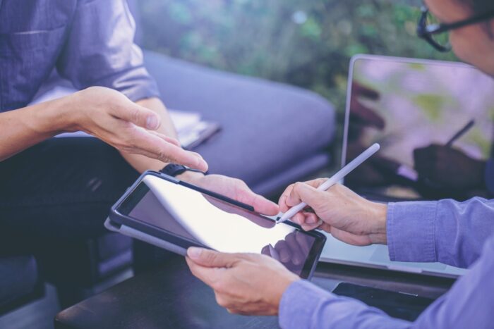 businessman got digital pencil puts signature digital contract business meeting after negotiations with business partners