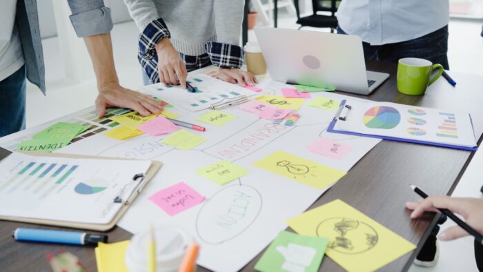 group casually dressed business people discussing ideas office