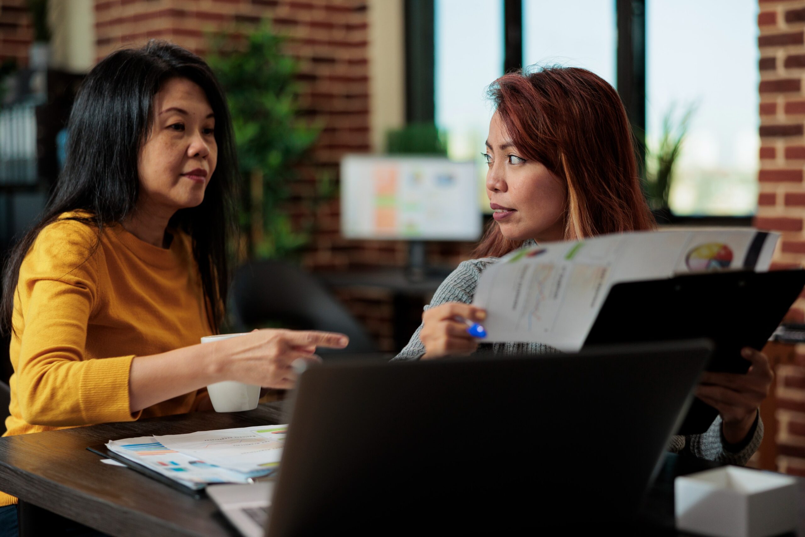 two woman discussing