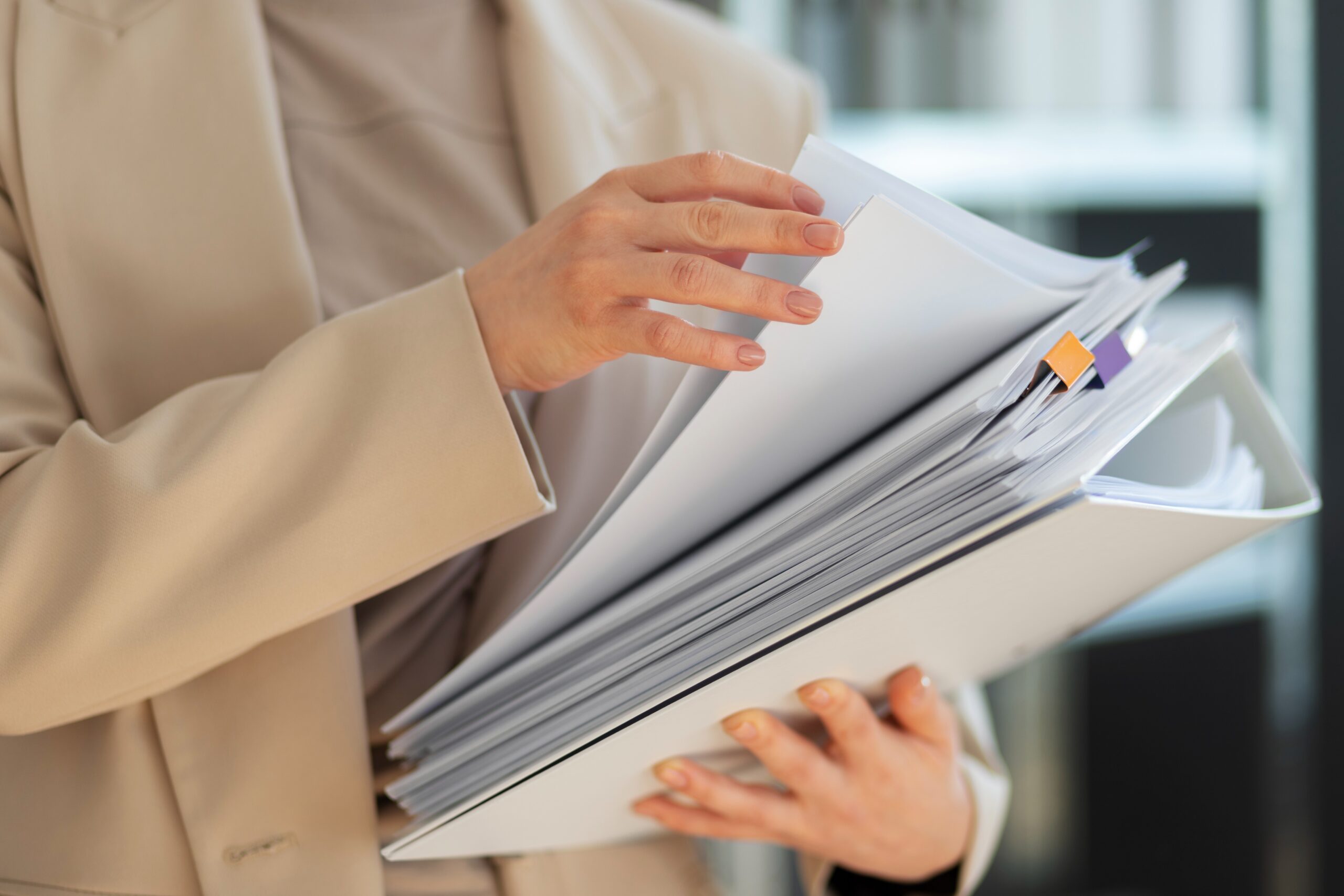 woman holding folders 