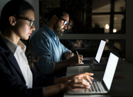 business teammates working late office