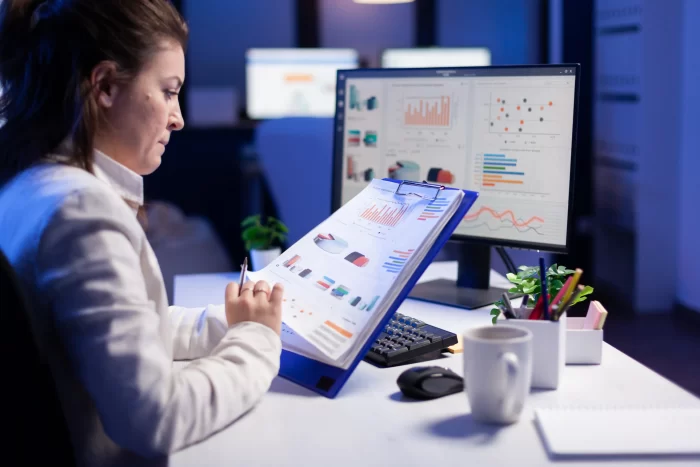 woman working with reports and data