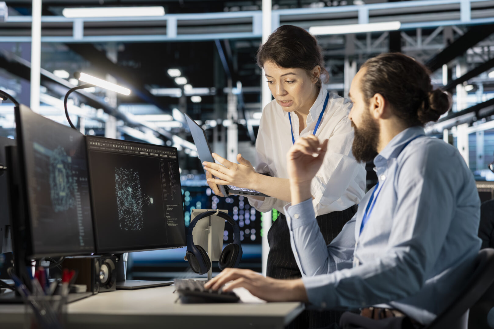 ICT provider: Engineering team doing brainstorming in server hub, using AI powered tech