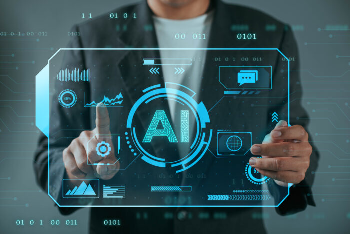 Business man using Artificial Intelligence (AI) in the futuristi Business man using Artificial Intelligence (AI) in the futuristi